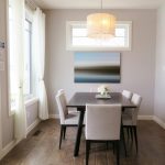 A bright, contemporary dining room with minimalist decor and modern furnishings.